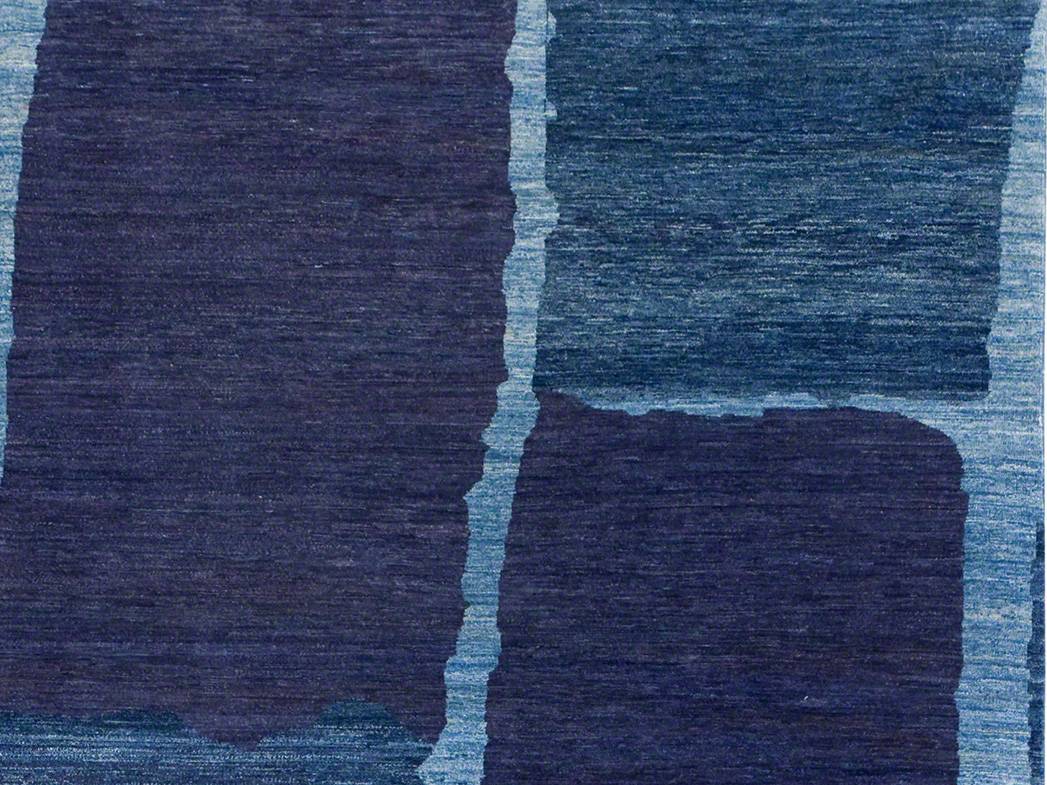 Blue floor rug with a stone pattern by ARZU