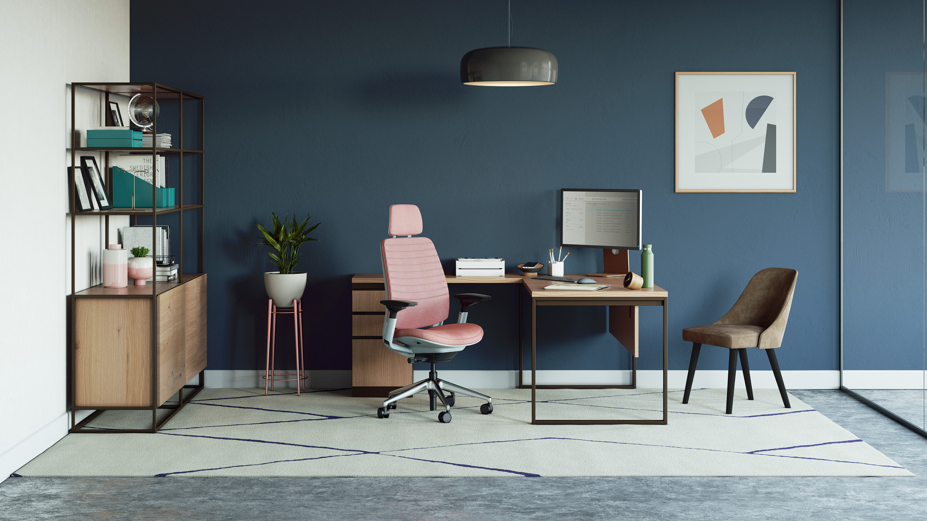 Private office space equipped with a pink Steelcase Series 2 Task chair, sitting in front of a West Elm Greenpoint Private Office Desk and a brown armless West Elm Sterling Guest Chair.