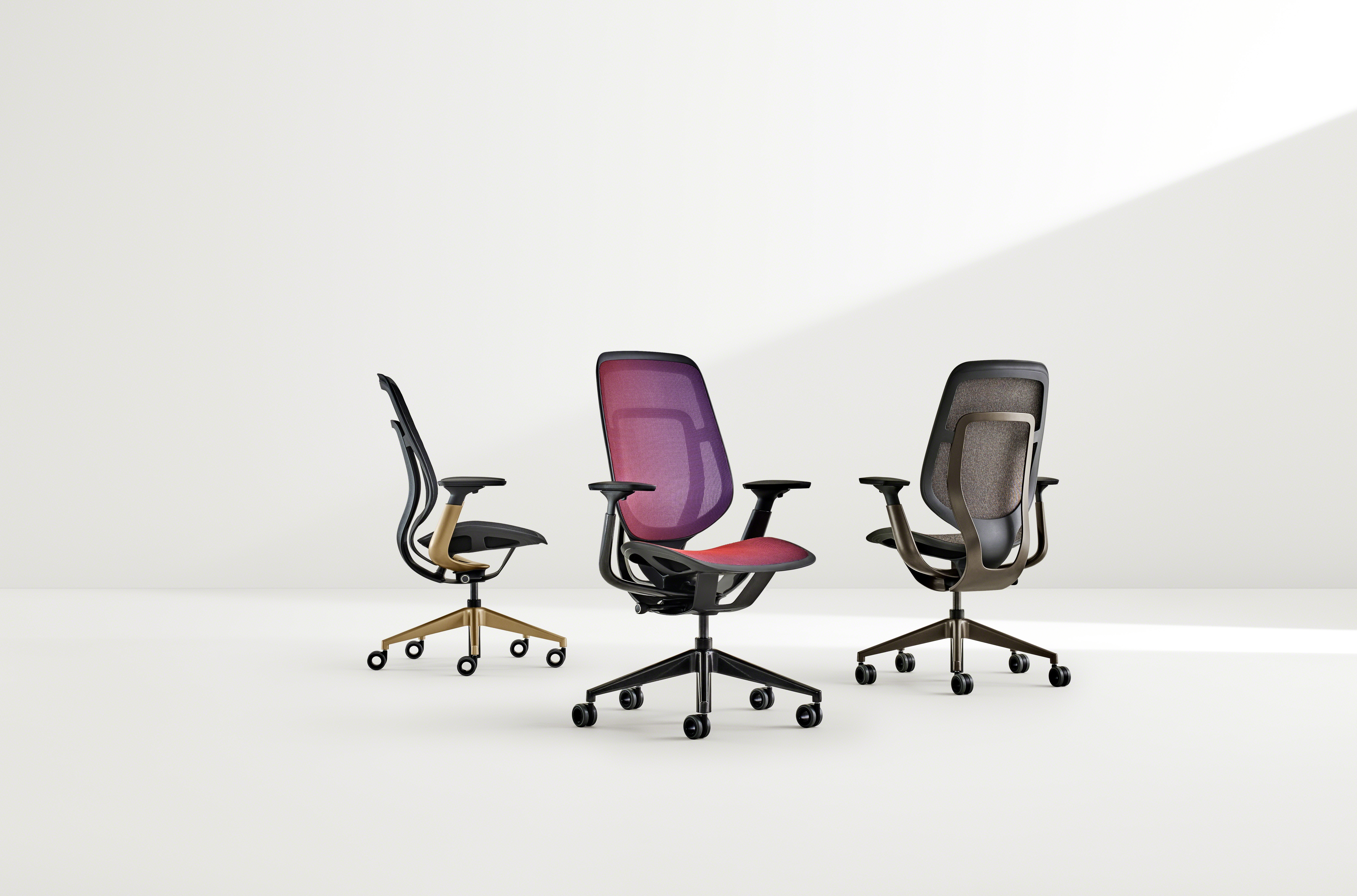 three karman chairs in different colors